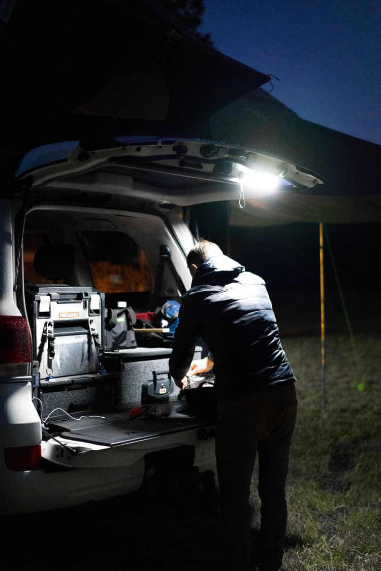 LED Power Bank Utility Torch lighting up a campsite